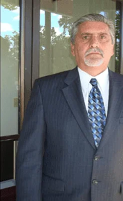 Attorney Richard A. Nunes in a navy suit