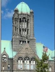 The green-domed Taunton courthouse tower against a blue sky